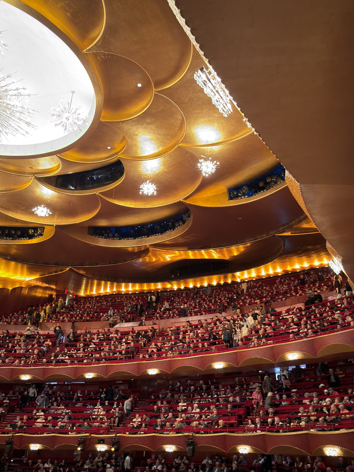House interior, gold ceiling and assembled audience, operator photograph